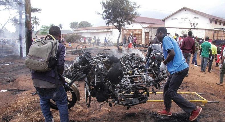 Footage from the crash scene showed the truck engulfed in fierce flames and huge clouds of smoke, with charred bodies among the burnt-out remains of motorcycle taxis