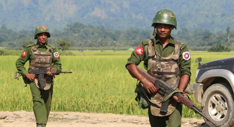 Armed Myanmar army soldiers patrol a village in Maungdaw located in Rakhine State October 21, 2016