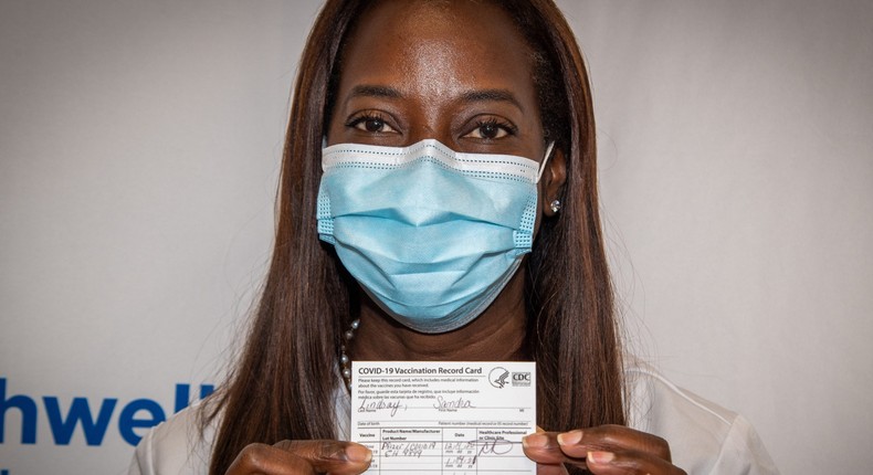 Sandra Lindsay, a critical care nurse in Queens, New York City, became the first person in the US outside of trials to receive a COVID-19 vaccine on December 14.