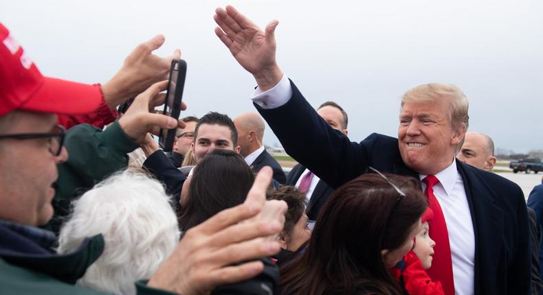 US President Donald Trump greets supporters after arriving on Air Force One at Green Bay Austin Straubel International Airport in Green Bay, Wisconsin, April 27, 2019, as he travels to hold a Make America Great Again rally. (Photo by SAUL LOEB / AFP) (Photo credit should read SAUL LOEB/AFP/Getty Images)