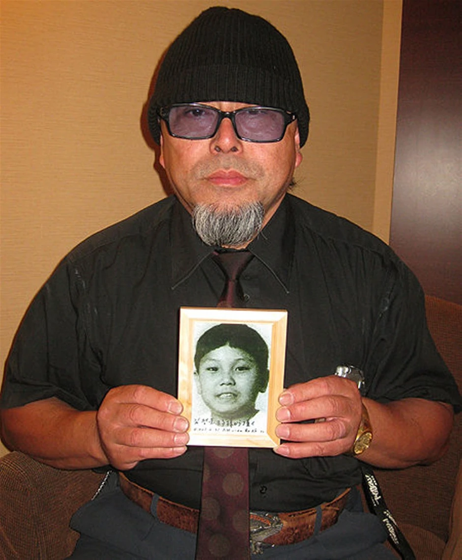 Fudžimoto sa fotografijom Kima Džong Una