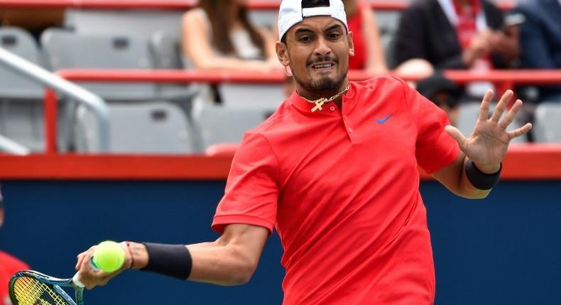 Nick Kyrgios hits a return against Viktor Troicki on August 7, 2017 in Montreal, Quebec, Canada