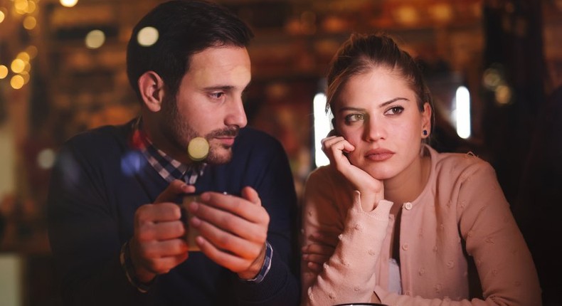 sad couple having coffee