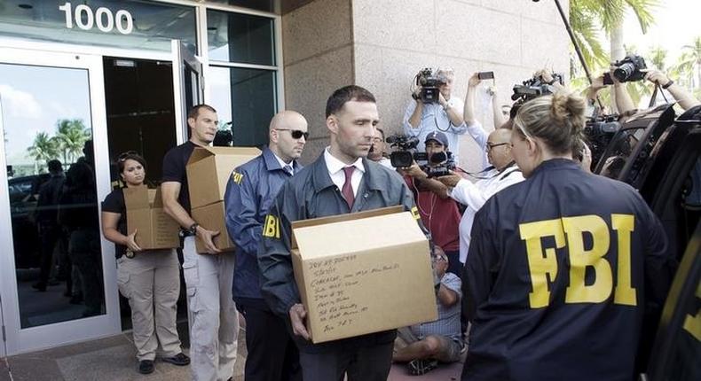 FBI agents bring out boxes after an operation inside the CONCACAF (Confederation of North, Central America and Caribbean Association Football) offices in Miami Beach, Florida May 27, 2015.  REUTERS/Javier Galeano