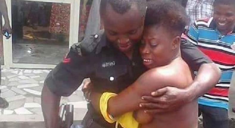 A police officer arresting a female offender in a unique way