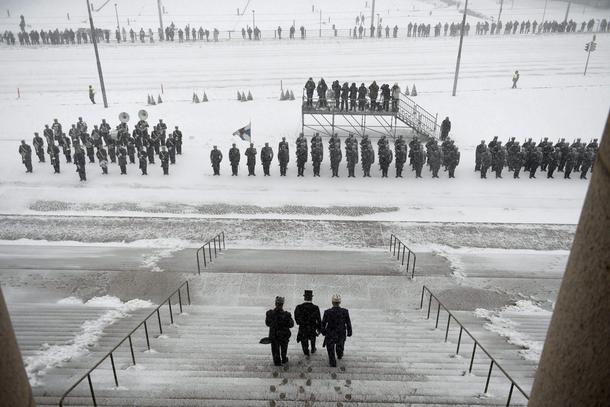 Re-elected Finnish President Sauli Niinisto heads to inspect the honorary guard outside the Finnish 