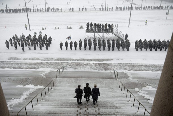 Re-elected Finnish President Sauli Niinisto heads to inspect the honorary guard outside the Finnish 