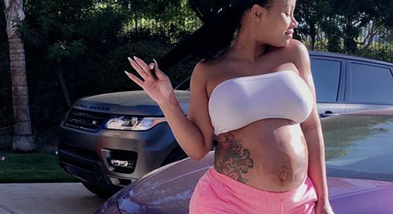 Blac Chyna flaunts bare baby bump, natural hair