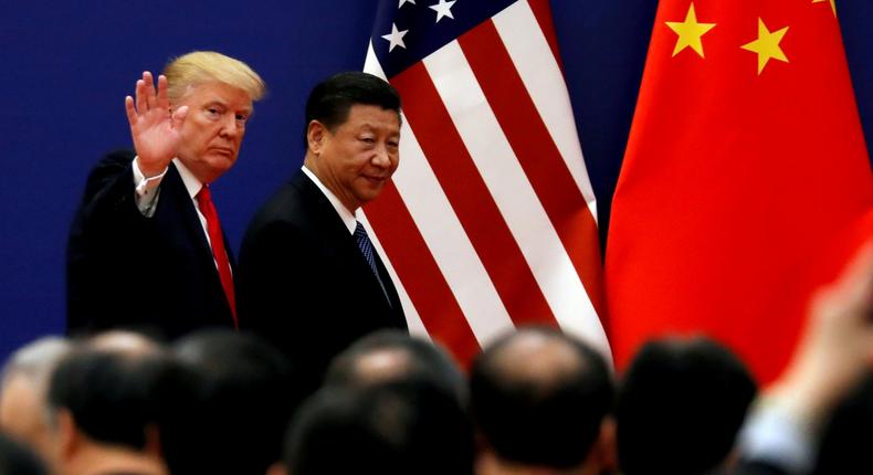 FILE PHOTO: U.S. President Donald Trump and China's President Xi Jinping meet business leaders at the Great Hall of the People in Beijing, China, November 9, 2017. REUTERS/Damir Sagolj/File Photo/File Photo