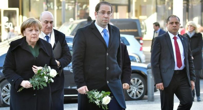 German Chancellor Angela Merkel (left) and Tunisian Prime Minister Youssef Chahed paid their respects to the victims of the Berlin Christmas Market attack as they visited the site at Breitscheidplatz, on February 14, 2017