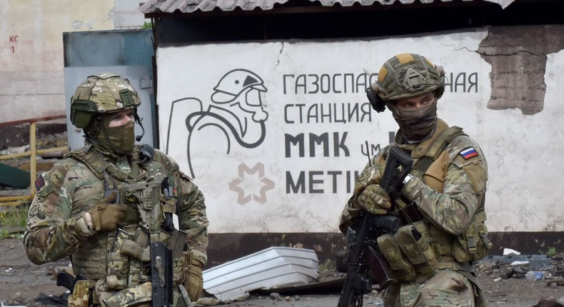 Russian servicemen stand guard at the destroyed part of the Ilyich Iron and Steel Works in Ukraine's port city of Mariupol on May 18, 2022, amid the ongoing Russian military action in Ukraine.