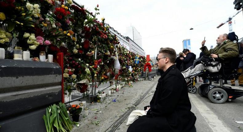 Shocked Swedes remember victims of Friday's lorry attack on a crowded Stockholm street