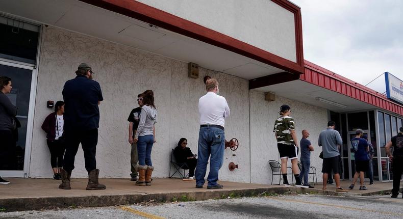People who lost their jobs wait in line to file for unemployment following an outbreak of the coronavirus disease (COVID-19), at an Arkansas Workforce Center in Fayetteville, Arkansas, on April 6, 2020.
