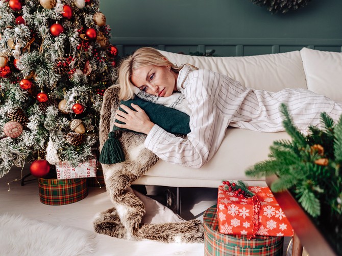 stock-photo-frustrated-depressive-sad-sick-woman-in-pajamas-lies-on-the-sofa-in-christmas-alone-holidays-alone-2071286675