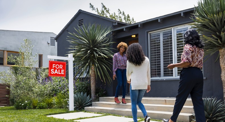 Potential homebuyers and a real estate agent.