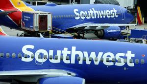 Southwest Airlines flight attendants are being attacked by exploding soda cans.Kevin Dietsch/Getty Images