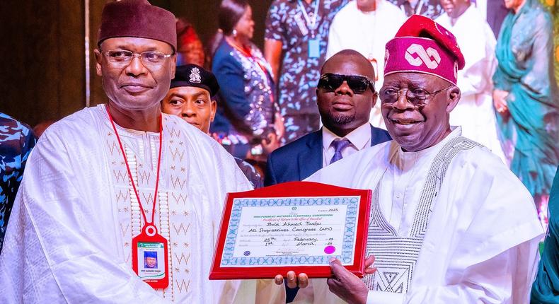 INEC chairman, Prof Mahmood Yakubu, presents certificate of return to president-elect, Bola Tinitu [Twitter/@BashirAhmaad]