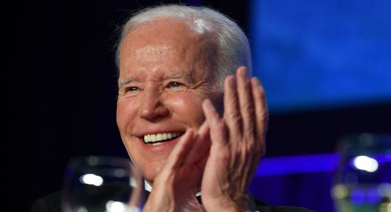 President Joe Biden laughs during the White House Correspondents' Association dinner in Washington, DC, on April 30, 2022.