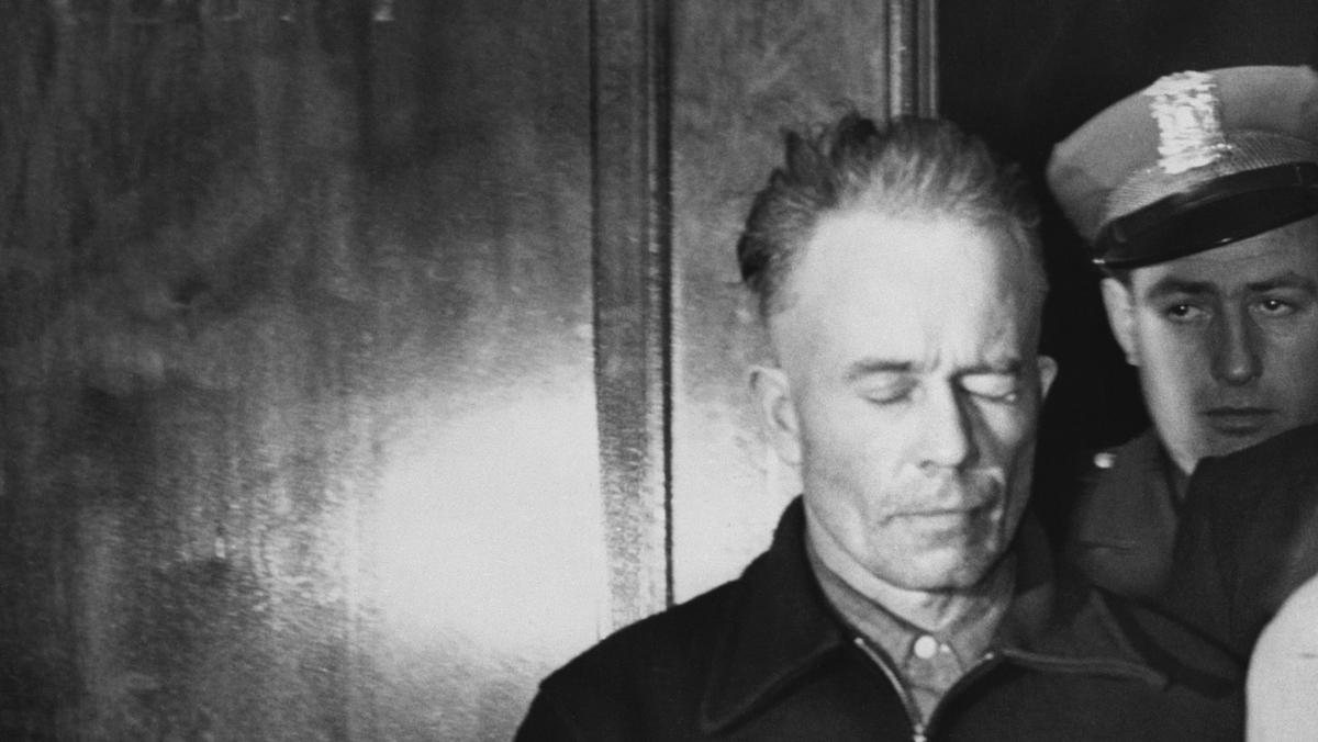 Ed Gein Being Led in Handcuffs