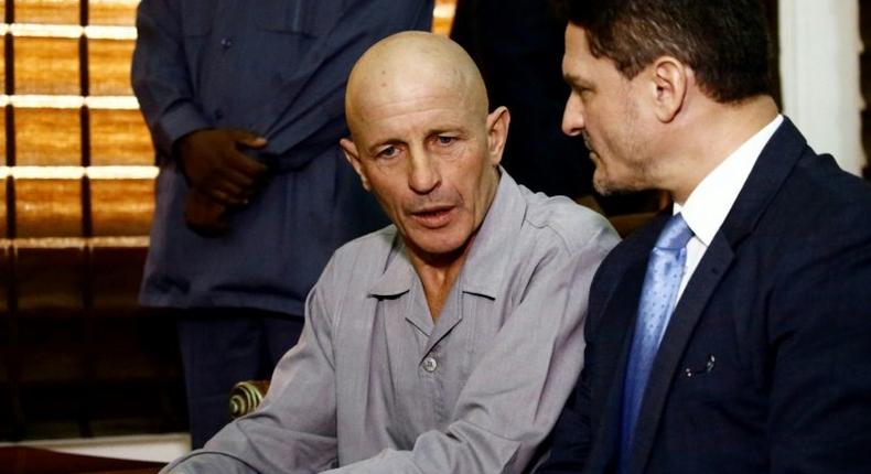 Frenchman Thierry Frezier who was kidnapped in Chad on March 23 speaks with French charge d'affaires in Khartoum Christian Bec on May 7, 2017, after being freed