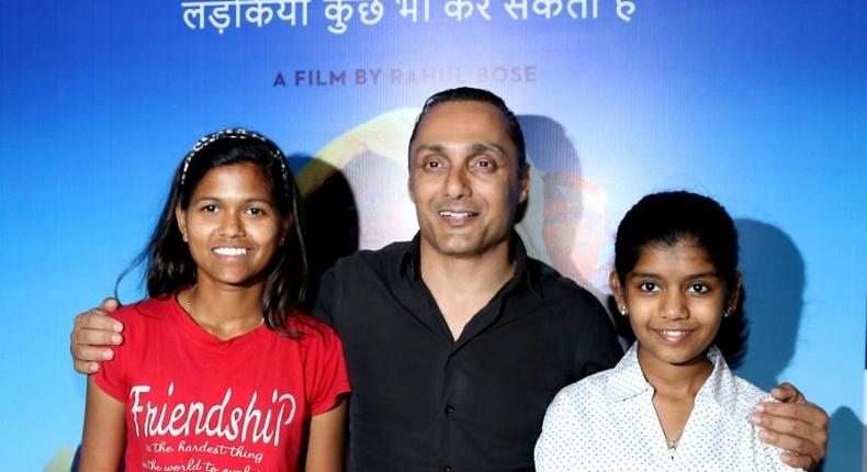 Indian mountaineer Poorna Malavath (L) and actress Aditi Inamdar (R) attend the screening of upcoming Hindi film ‘Poorna’ directed by Rahul Bose (C) in Mumbai on March 27, 2017