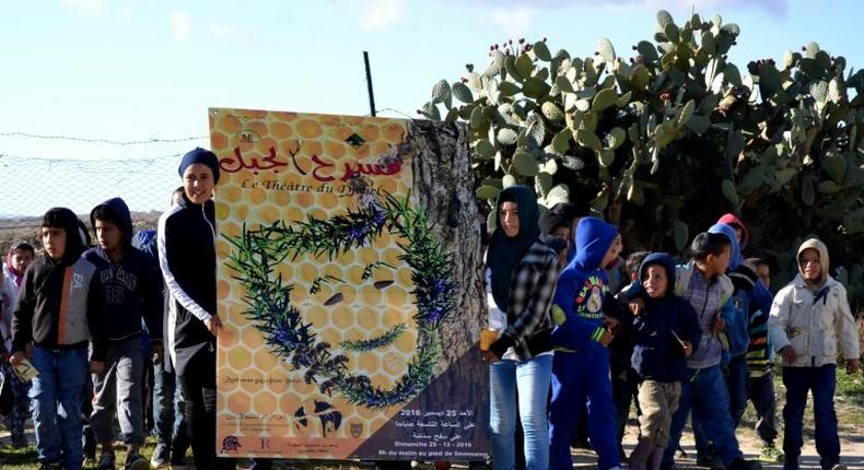 Tunisian children perform on Mount Sammama, as part of a project by the Jabal Theatre to use traditional culture and drama to combat the appeal of jihadist ideology