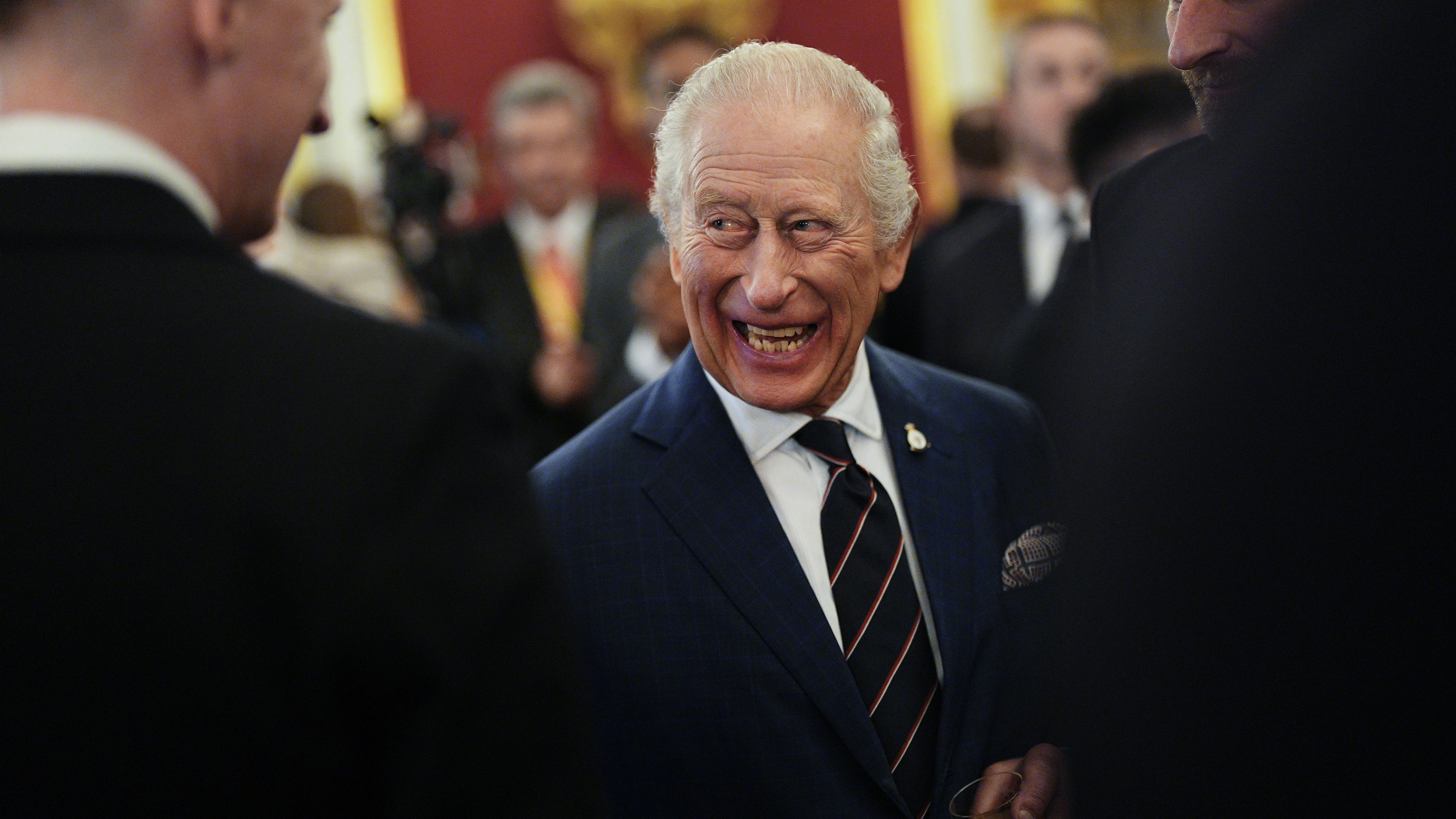 King Charles asks about bombs and families at HMS reception