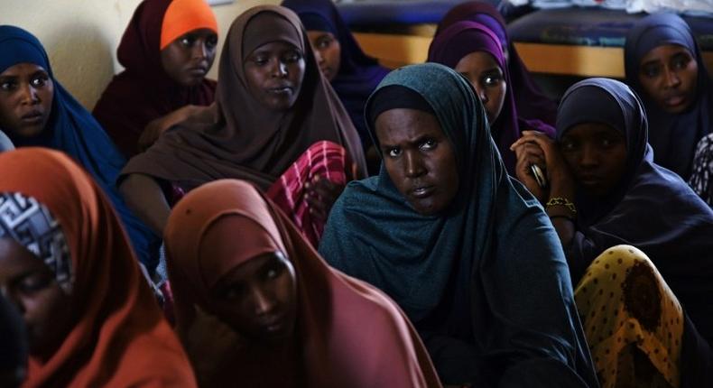 A group of Kenyan women listen during a course at the local maternity facility on what Islam allows and does not allow in terms of family planning, and on the benefits of family planning at a village in north-eastern Wajir County