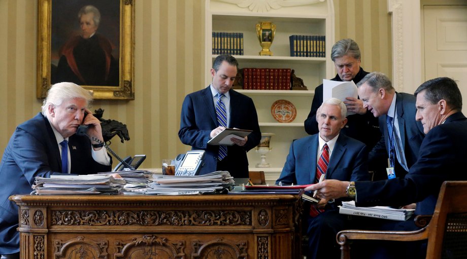 US President Donald Trump, with Chief of Staff Reince Priebus, second left, Vice President Mike Pence, senior advisor Steve Bannon, Communications Director Sean Spicer, and National Security Advisor Michael Flynn, far right.