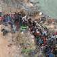 MONITORING Asylum seekers supervised by border control agents who cut wire to allow entry to Texas for processing.