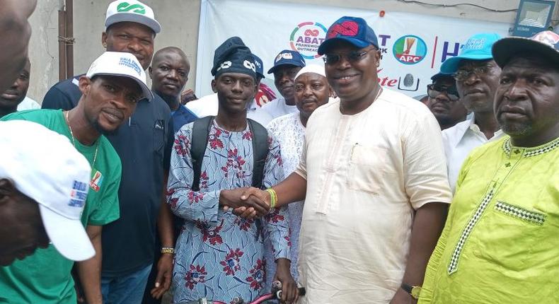 Mr Gaddafi Musa, a 26-year-old native of Funtua, Katsina State (left), shake hands with Mr Fola Tinubu,  Convener and Director-General, Bola Tinubu 4 President 2023 Support Group, on Wednesday in Lagos.