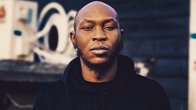 Seun Kuti walking on the Paris Fashion Week runway [Instagram/BigBirdKuti]