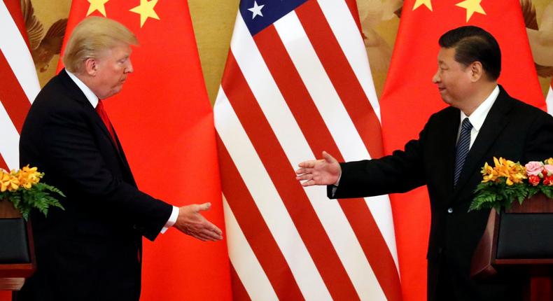 trump xi shake hands