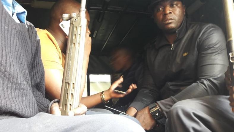 Embakasi Central MP Benjamin Gathiru (in yellow shirt) at the back of a police Land Rover (Twitter)