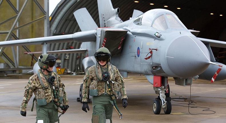 ts and ground crew prepare combat aircraft Panavia Tornados at RAF Marham on December 2, 2015 at RAF Marham, United Kingdom.