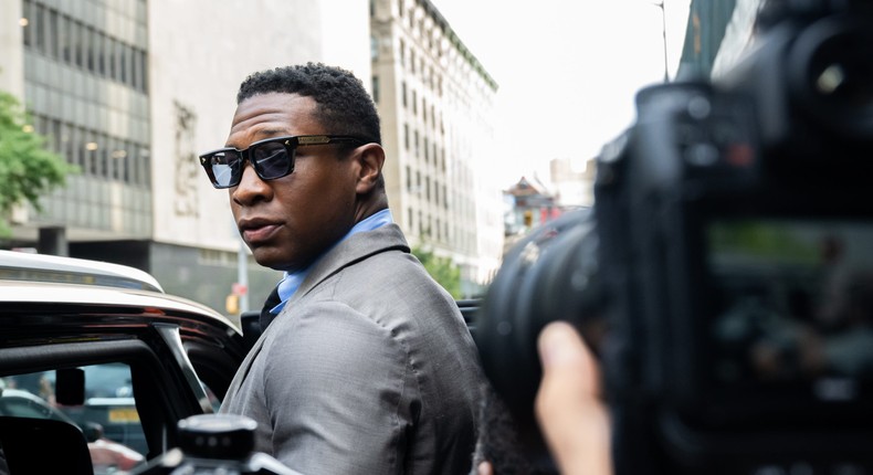 Jonathan Majors, looks backs at reporters while leaving Manhattan Criminal court after a pre-trial hearing in August 2023.Alexi Rosenfeld/Getty Images