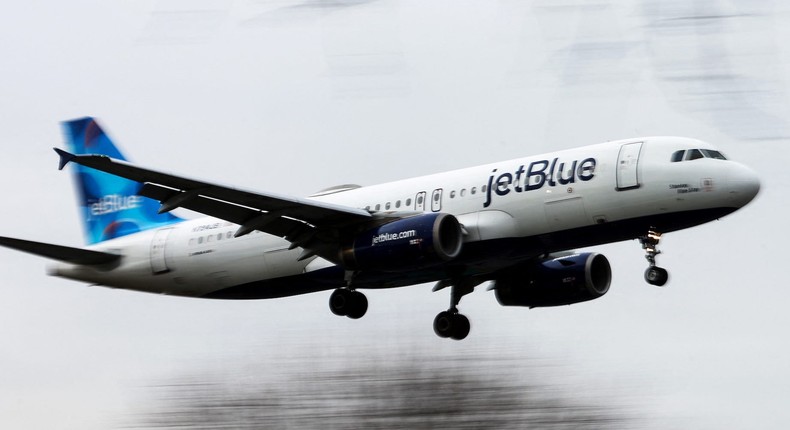 A JetBlue Airways jet comes in for a landing at LaGuardia Airport in New York City in January 2023.REUTERS/Mike Segar