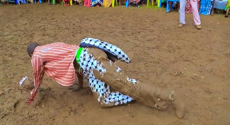Kisii musician Chris Embarambamba rolling in the mud
