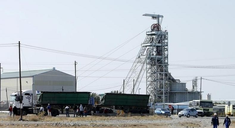 Workers leave Lonmin's Karee mine at the end of their shift, outside Rustenburg, northwest of Johannesburg July 29, 2015. REUTERS/Siphiwe Sibeko