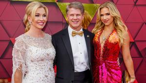 Tavia Shackles Hunt, Clark Hunt, and Gracie Hunt walk the red carpet at the Kansas City Chiefs ring ceremony in June 2023.Jason Hanna/Stringer/Getty Images