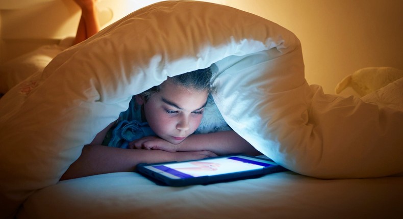 Turn off tablets and other devices at least one hour before bedtime to improve your child's sleep without melatonin.Adam Gault / Getty Images