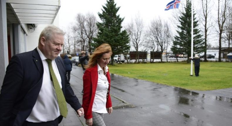 Iceland's Prime Minister Sigurdur Ingi Johannsson (L) leaves a polling station with his wife Ingibjoerg Elsa Ingjaldsdottir after voting in Fludir, Iceland, during the snap general election, on October 29, 2016