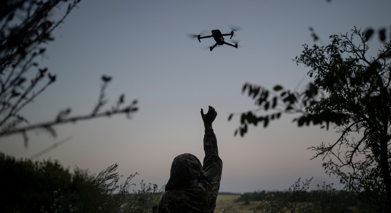 A Ukrainian drone pilot reaches for a reconnaissance drone in the Luhansk Region, Ukraine, Saturday, Aug. 19, 2023.AP Photo/Bram Janssen