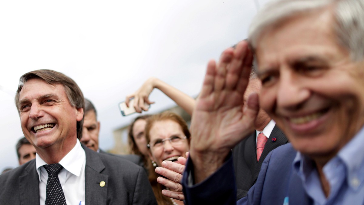 FILE PHOTO: Federal deputy Jair Bolsonaro speaks with Augusto Heleno Pereira, during a protest against former Brazilian president Luiz Inacio Lula da Silva, in Brasilia