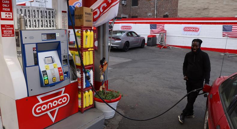 A person pumps gasoline at a Conoco gas station, a brand owned by Phillips 66, in Brooklyn, New York, U.S., November 11, 2021.