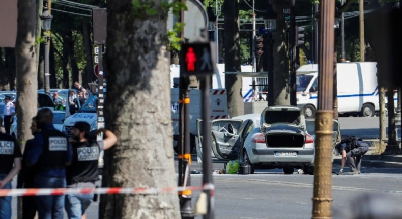 Authorities quickly sealed off the world-famous Champs-Elysees avenue after a 31-year-old man on a jihadist watchlist rammed a car loaded with guns and a gas bottle into a police