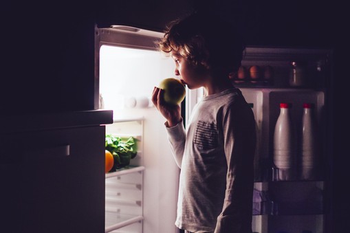 Little boy having a bedtime snack