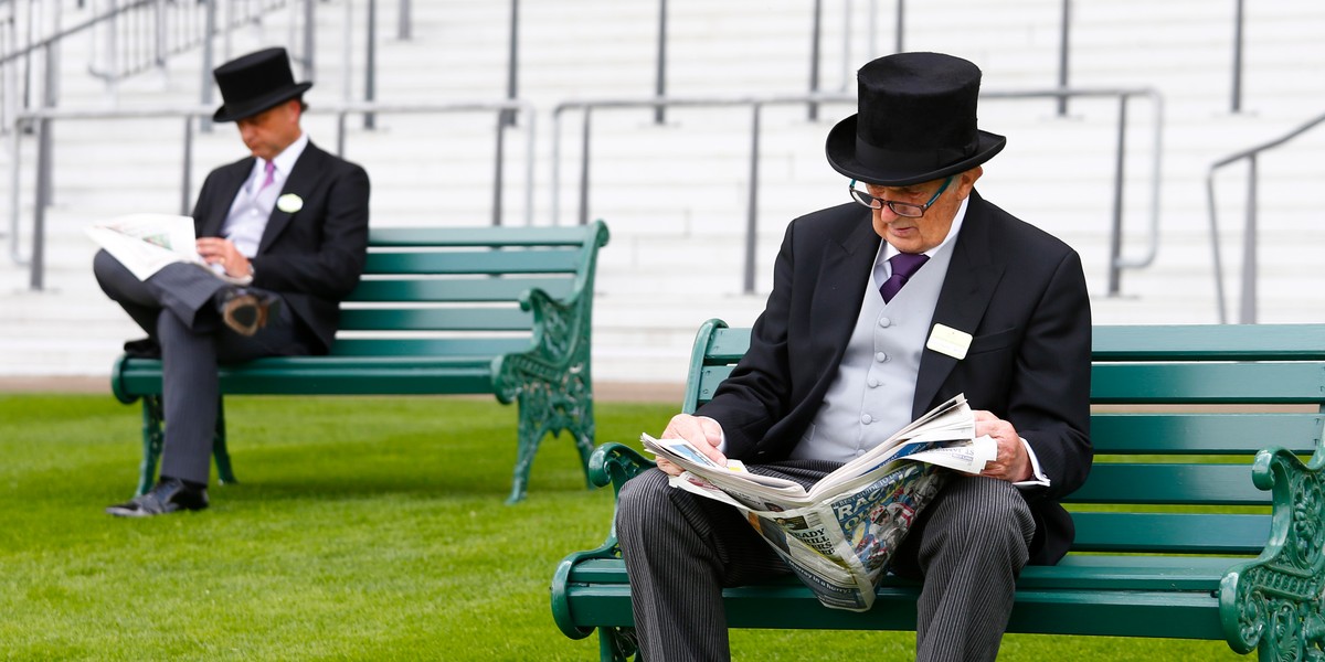 Horse Racing - Royal Ascot - Ascot Racecourse - A racegoer reads the newspaper, June 16, 2015