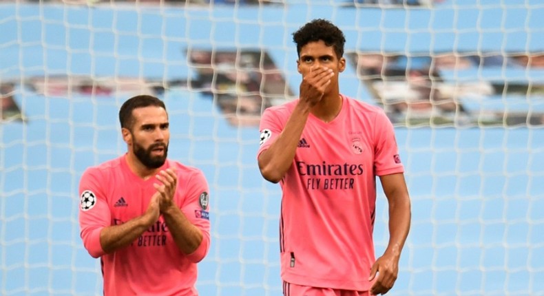 'Blame me': Real Madrid's French defender Raphael Varane (right) reacts after Manchester City's Raheem Sterling opened the scoring