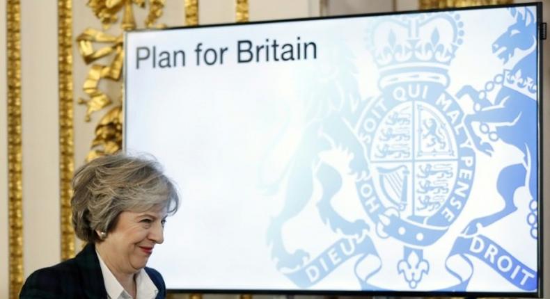 British Prime Minister Theresa May said MPs would be presented with a white paper policy document outlining her Brexit negotiating strategy, though she did not say when it would be published